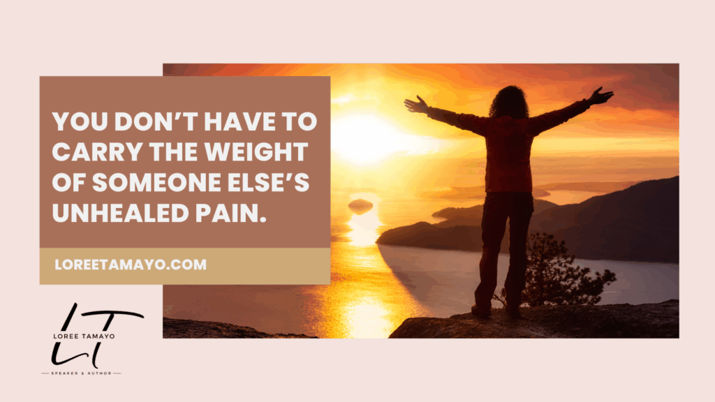 The image shows a person standing on a mountain at sunset with arms outstretched toward the glowing horizon over water and islands. The text reads: “You don’t have to carry the weight of someone else’s unhealed pain.” LoreeTamayo.com is displayed below, along with Loree Tamayo’s logo and title, Speaker & Author.