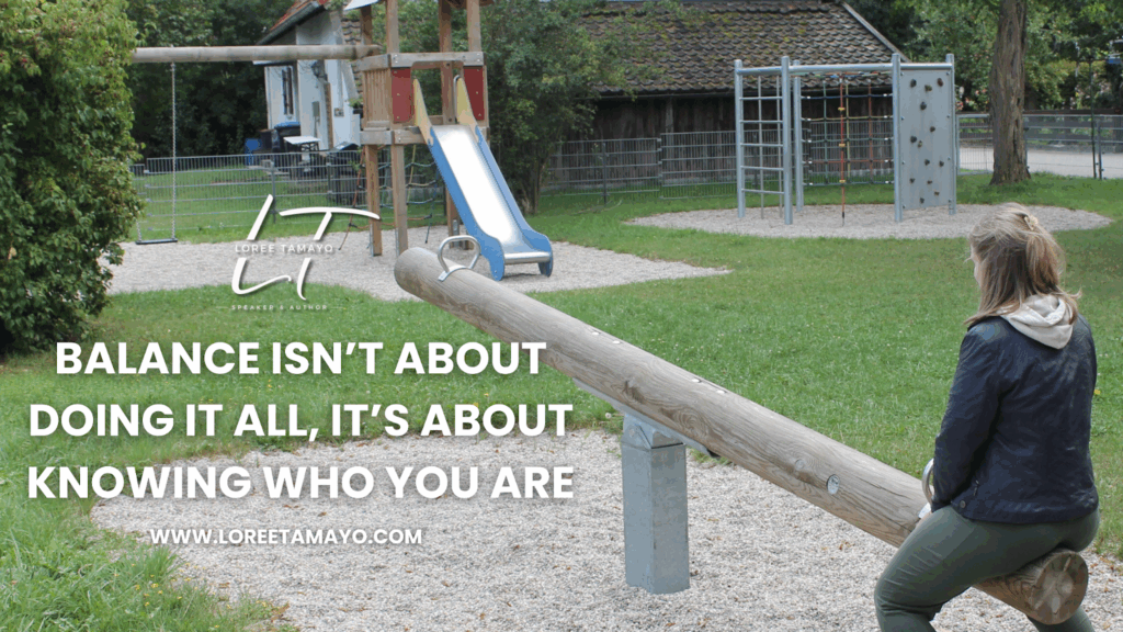 A woman sits alone on one end of a seesaw in an empty playground, symbolizing the search for balance and self-understanding. The Loree Tamayo logo appears on the left beside the text: ‘Balance isn’t about doing it all; it’s about knowing who you are.’ The website www.loreetomayo.com is displayed below.